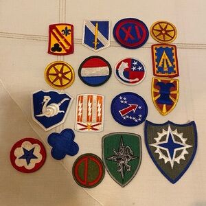 This collection consists of various vintage military shoulder insignia patches